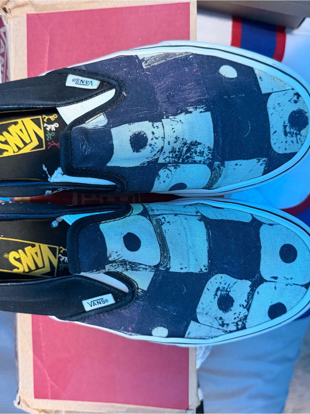 Vans Slip-On Sneakers in Black and Light Blue Graphic Print
